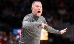 WATCH: Nuggets’ head coach Michael Malone ejected after running on to court, getting held back by Nikola Jokic