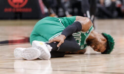 Celtics’ Marcus Smart helped off court after rolling ankle in win over Raptors